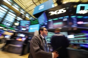 US stock futures surge as Trump retracts threats to dismiss Fed chair; Tesla soars.