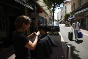 Police investigate potential arson as Cannes and areas of southern France experience power outage.