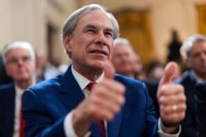 Texas governor enacts the biggest school voucher law in the U.S., signaling a conservative change.